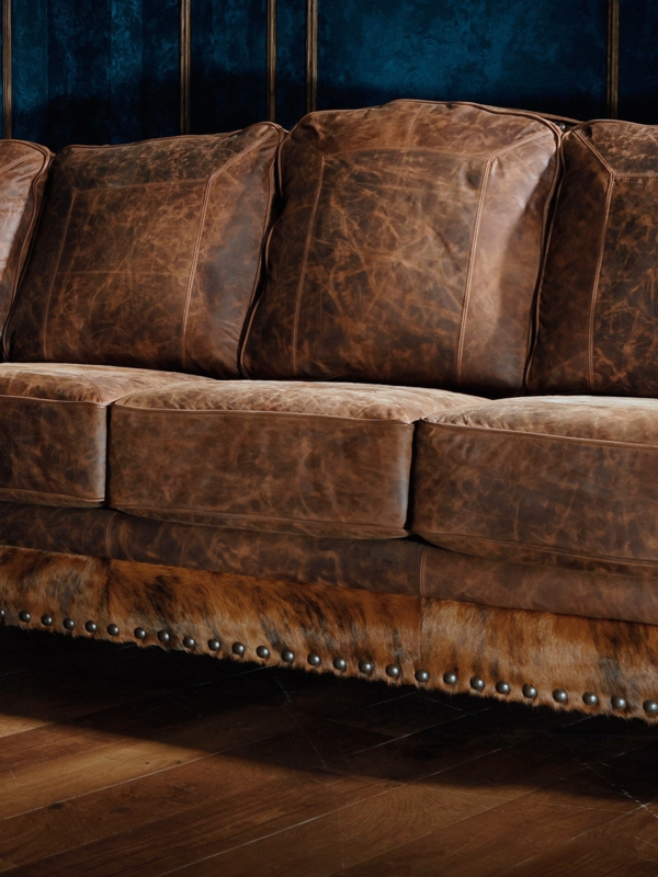 Western Sectional Sofa with Cowhide Panel Accents and Nailhead Trim