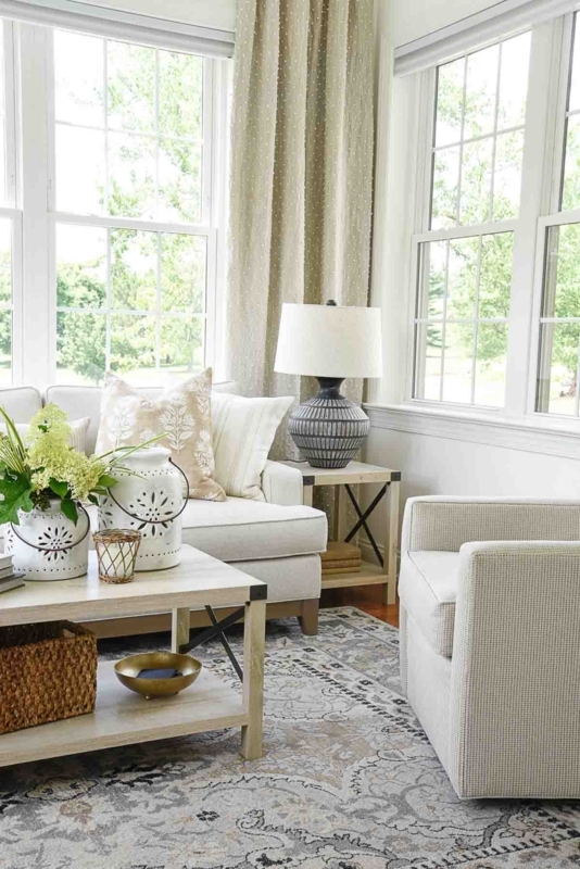 Wood Dining Table With Slipcovered Chairs and Oversized Urn