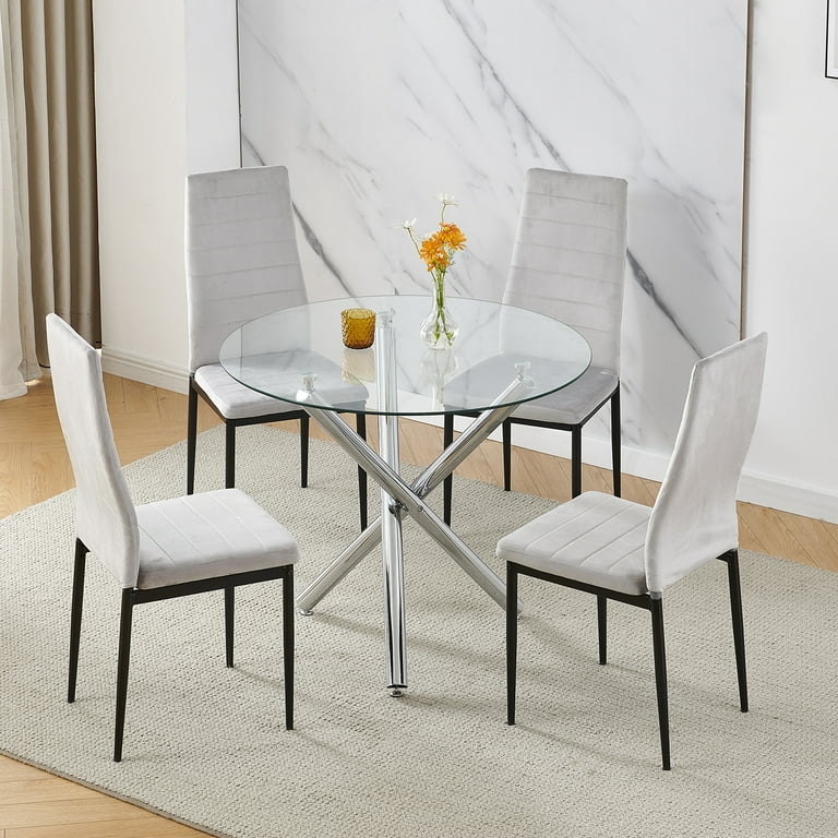 Airy Round Glass Dining Table with Architectural Flared Silver Legs