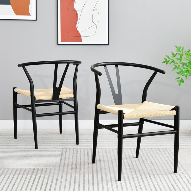 All Black Wishbone Dining Chairs with Woven Seats in Minimalist Setting.