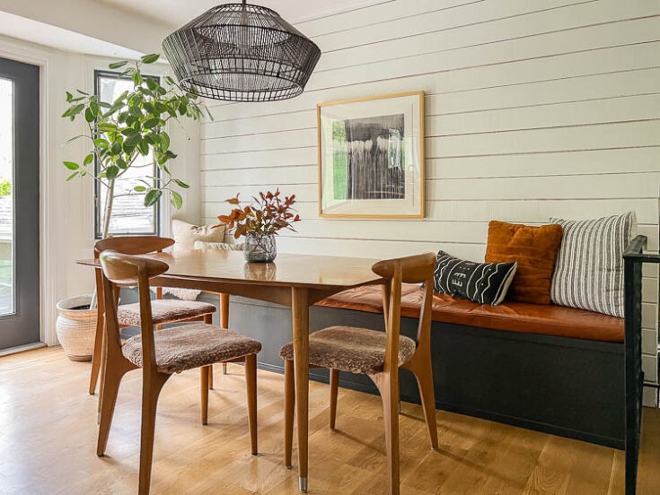 Banquette Bench Built-in Charcoal Paneling Round Pedestal Table