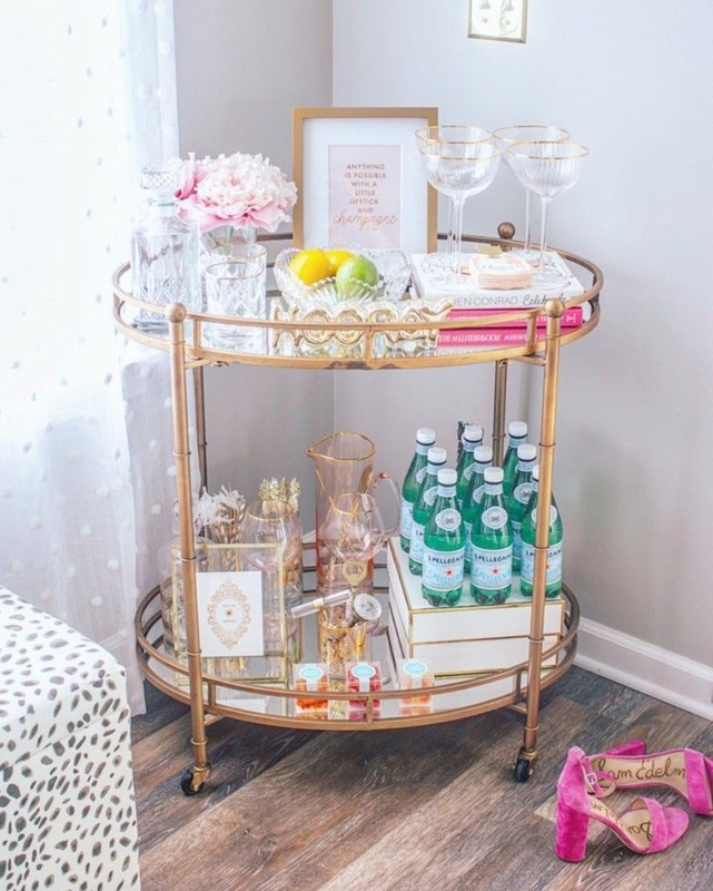 Bar Cart Polished Gold Mirrored Shelves Floral Wallpaper Backdrop.
