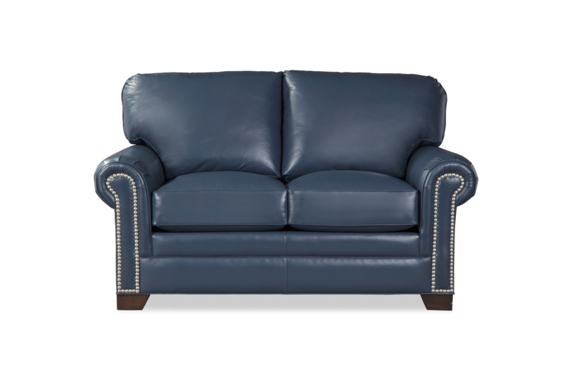 Beige Upholstered Loveseat with Rolled Arms and Nailhead Trim