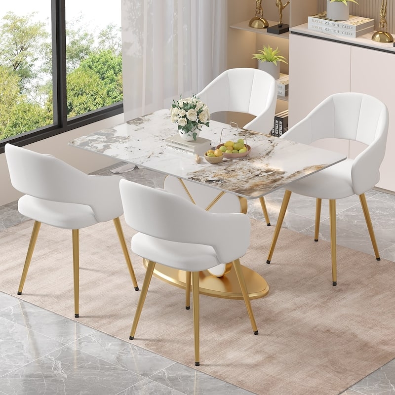 Blush Pink Velvet Dining Chairs with Curved Backs and Gold Tapered Legs
