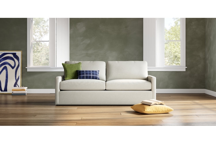 Cream Textured Loveseat with Curved Silhouette and Tapered Dark Legs