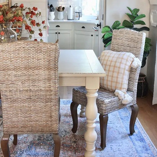 Dining Chairs: Modern Arched Black Frame with Woven Rattan Panels.