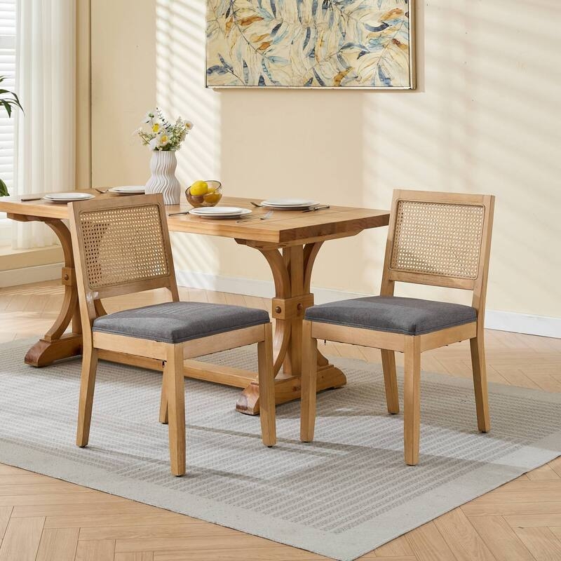 Dining Chairs: Natural Hardwood Frame Pair with Woven Cane Backs.