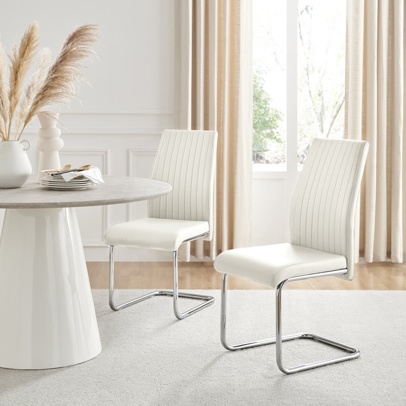 Dining Chairs: Sleek White Faux-Leather Armless Silhouette with Chrome