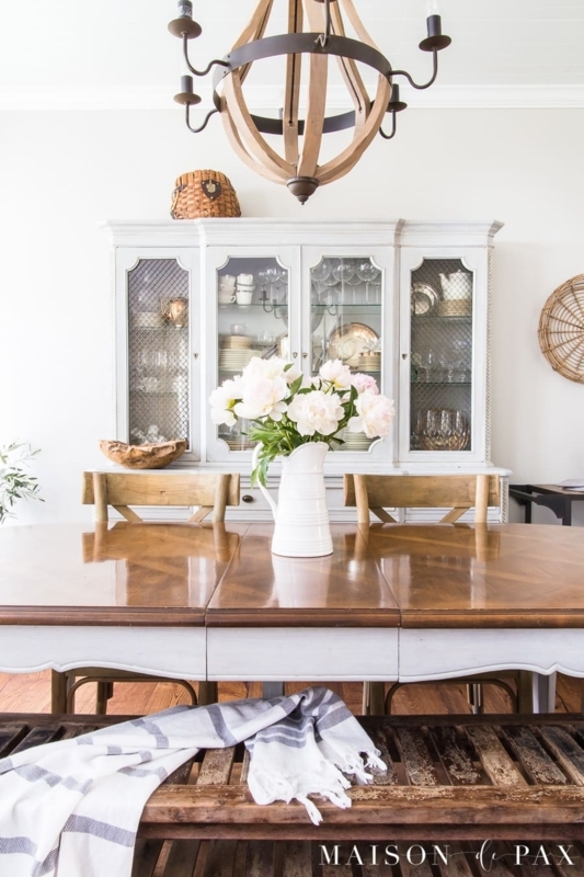 Dining Table in Wood Tone with Black Spindle Back Chairs