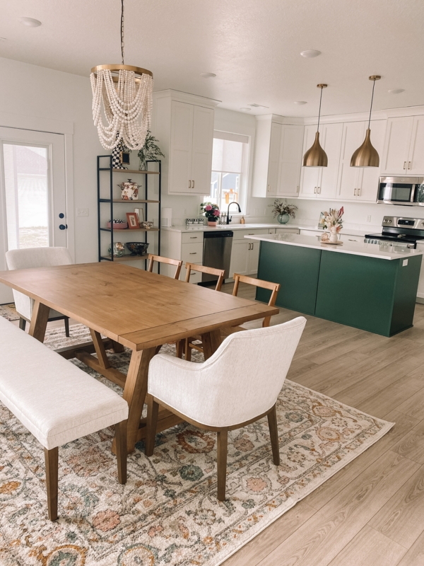 Dining Table: Round Pedestal Base with Black Spindle Back Chairs