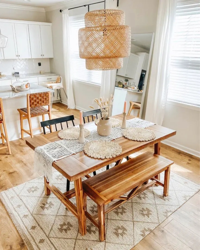 Dining Table with Woven Rattan Chairs and Botanical Triptych Wall Art