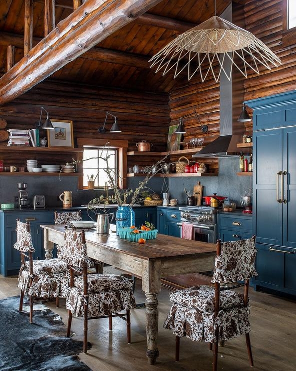 Eclectic Cabin Kitchen with Navy Cabinets & Wood Paneled Ceiling.
