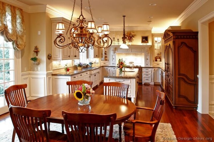 Farmhouse Kitchen with Exposed Ceiling Beams, Navy Cabinetry and Rustic Feel