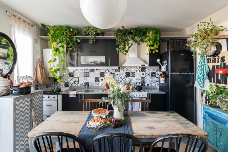 Kitchen with Geometric Tile Backsplash and lush Indoor Jungle Styling