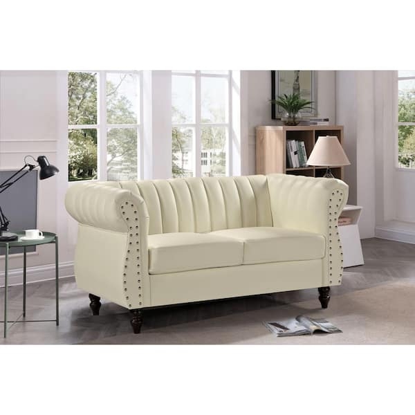 Loveseat in Cream Faux Leather with Polished Silver Legs