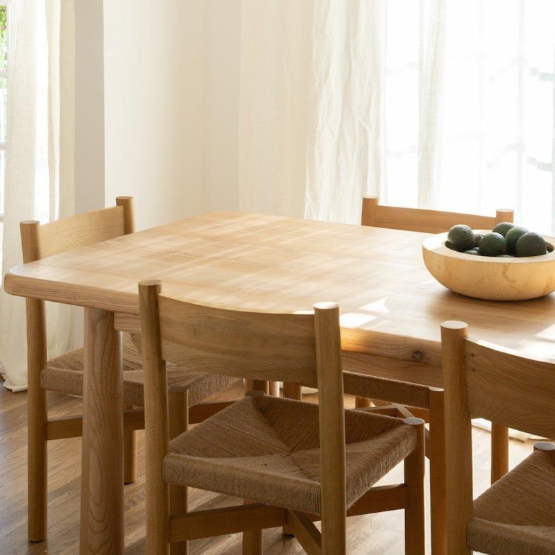 Minimalist Light Wood Dining Table with Oversized Cylindrical Legs