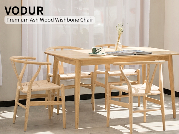 Minimalist Wooden Wishbone Chair with Woven Pattern Seat near Plant.