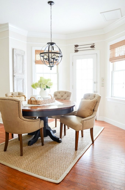 Round Pedestal Dining Table Setup with Coastal Chic Blue Decor