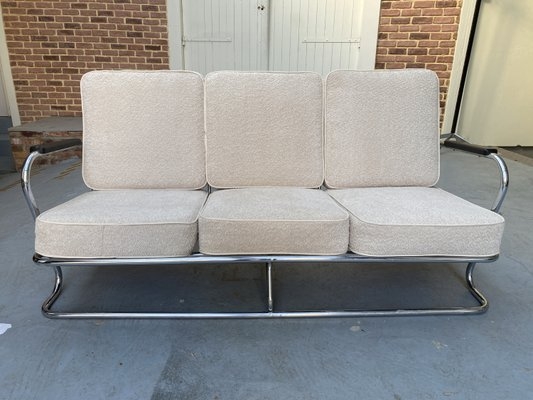 Sofa with Wraparound Tubular Chrome Frame in Dark Brown Leather-like.