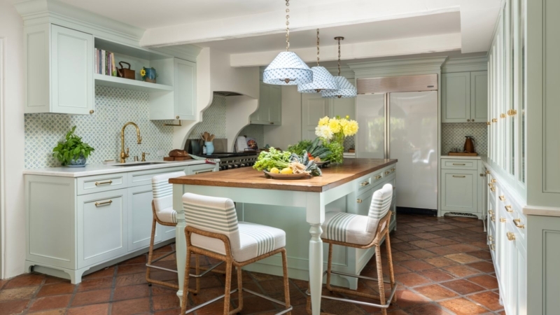 Spanish Colonial Kitchen with Arched Doorway and Vertical Tile