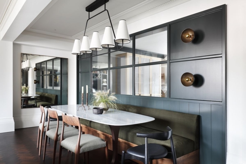 Transitional Dining Room with Wall Paneling and Linear Chandelier