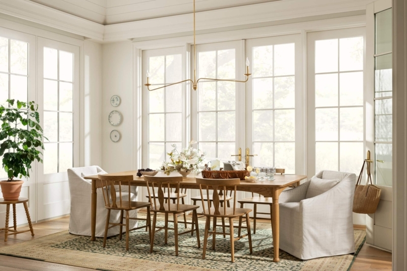 Transitional Dining Table with Mixed Seating and Skirted Armchair