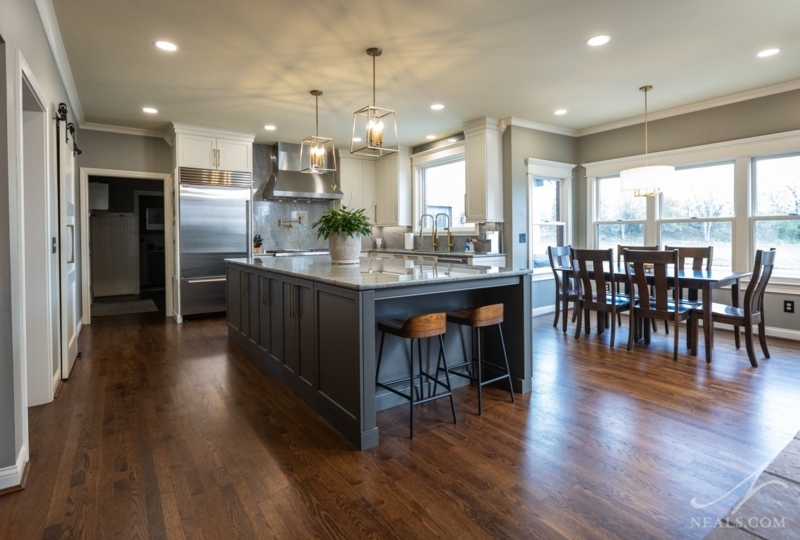 Transitional Kitchen Island Waterfall Edge with Dark Wood Cabinetry