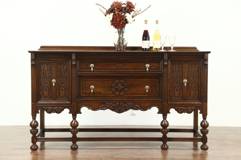Tudor Revival Sideboard featuring Geometric Carving and Stretcher Base