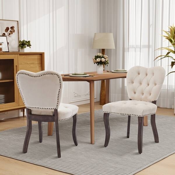 Upholstered Dining Chairs with Curved Cabriole Legs and Nailhead Trim