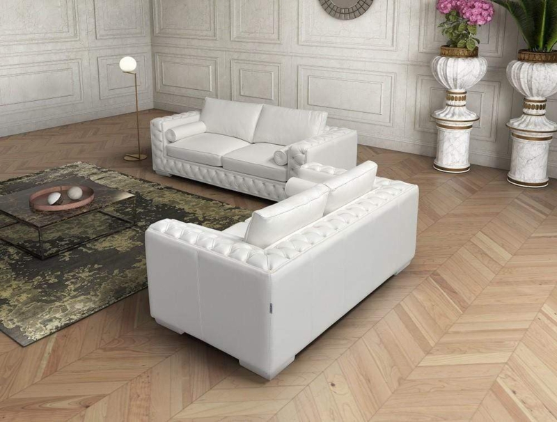 White Leather-Like Loveseat featuring Adjustable Headrests and Low Profile