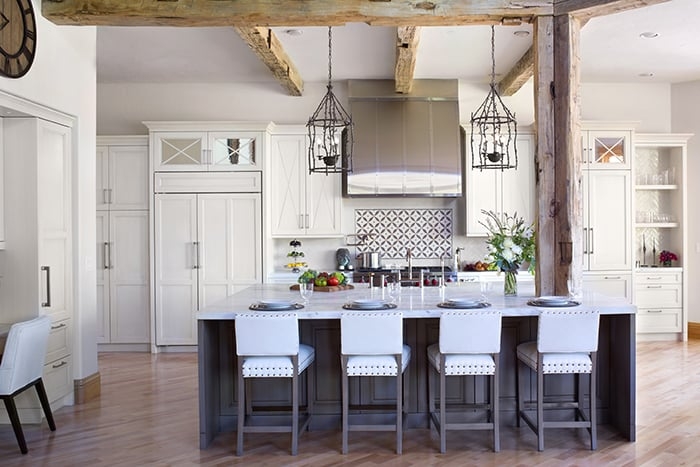 White Shaker Kitchen with Wood Island and Glass Pendants