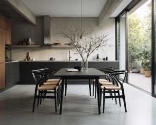 Wishbone Dining Chair in Ebony Finish with Natural Woven Seat Contrast.