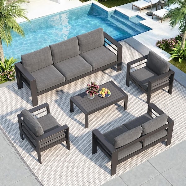 Grey Aluminum Patio Set with Wood Toned Armrests & Box Cushions