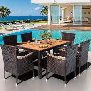 Outdoor Dining Set with Wood Toned Tabletop and Wicker Texture