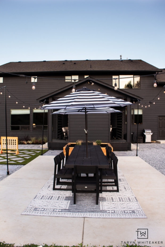 Outdoor Dining Table Wood-Toned with Black Woven Chairs Minimalist Set