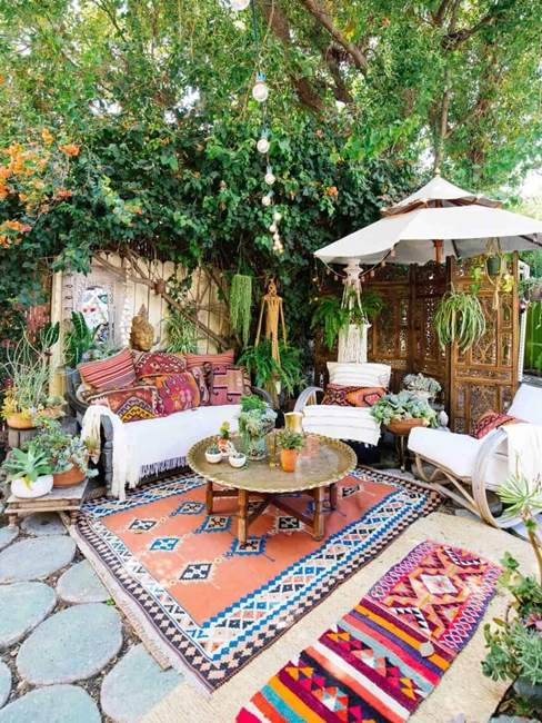 Patio Furniture Set with Layered Area Rugs, Dense Greenery