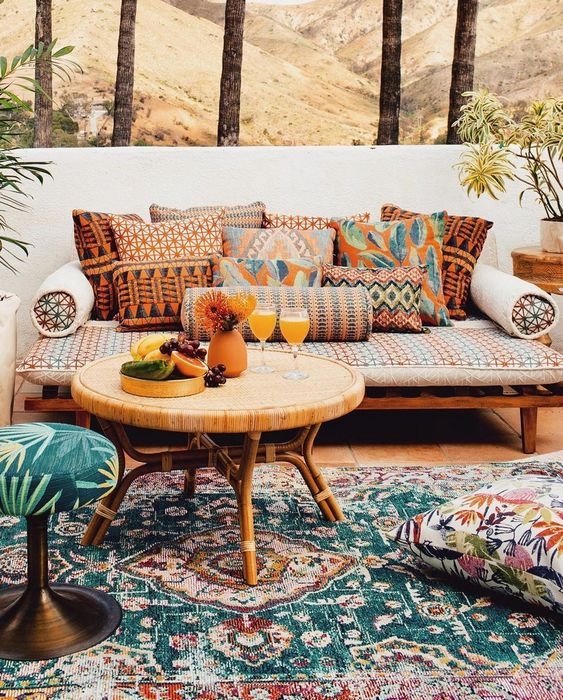 Patio Scene with Eclectic Textiles, Layered Rugs, Natural Rattan