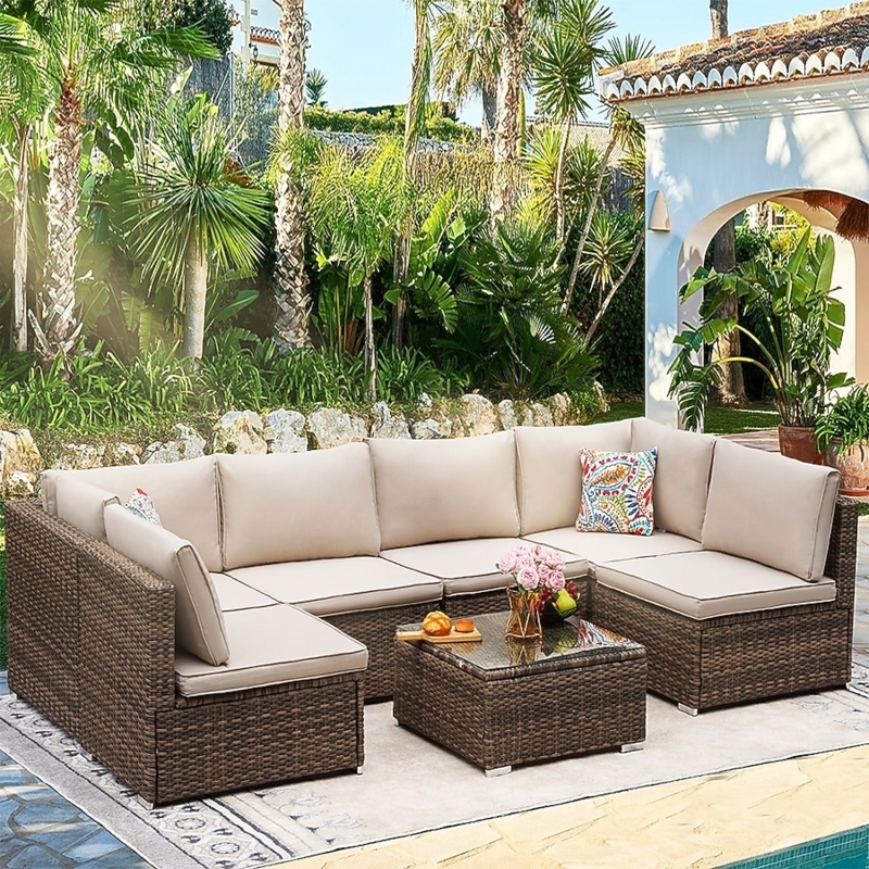 Rattan Sectional Sofa with Terracotta Red Cushions and Glass Table