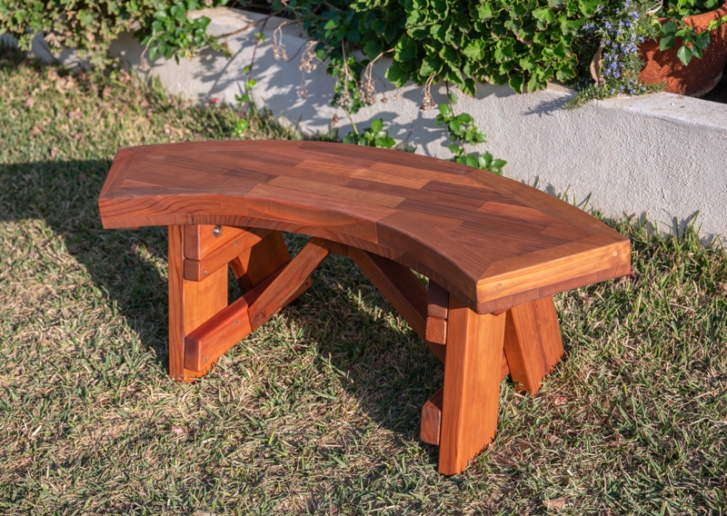 Rustic Wood Garden Benches. Arc shape, thick block legs, slatted seat.