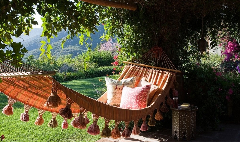Vibrant Orange Bohemian Hammock with Macrame Detailing and Tassel Fringe