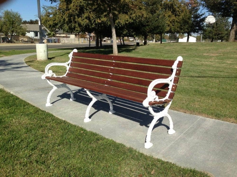 Victorian Garden Bench featuring Ornate Scrollwork Arms and Metal Frame