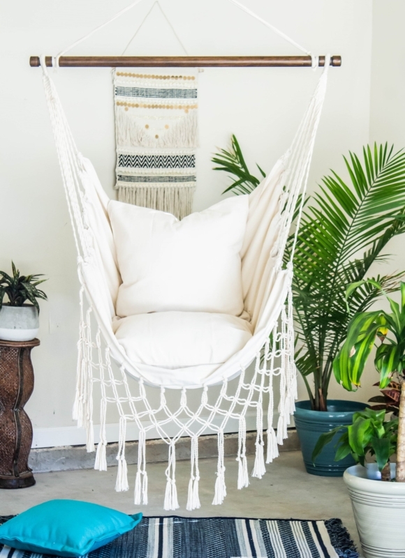 White Macrame Hammock Chair with Intricate Knotting and Fringe Detail