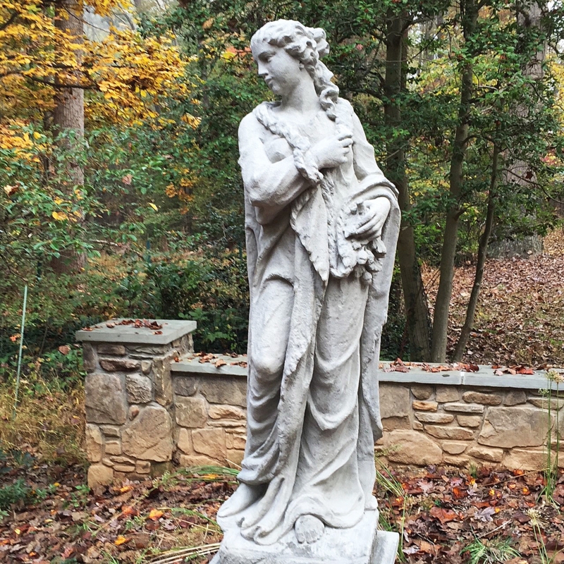 Allegorical Garden Statue representing Winter on Tiered Stone Pedestal