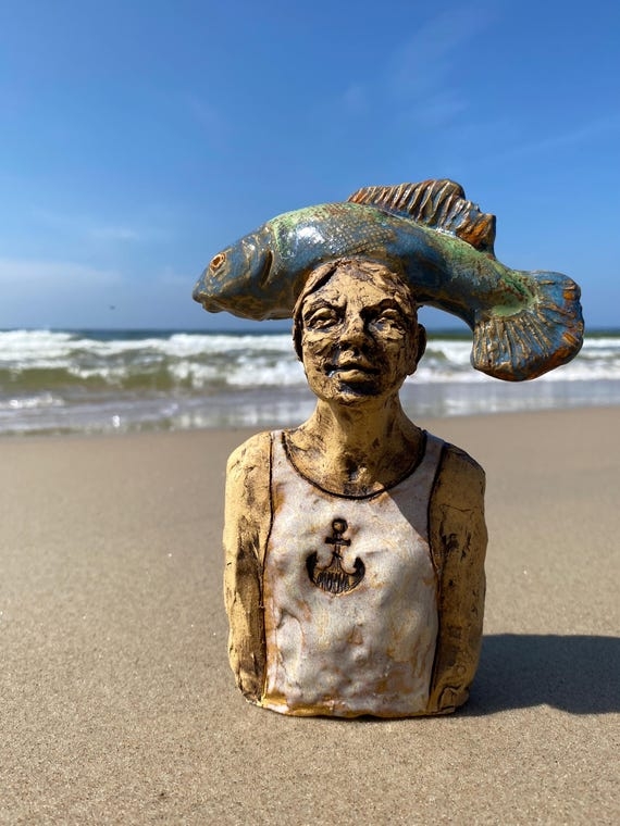 Artisan Ceramic Boy with Metallic Fish Decorative Sculpture