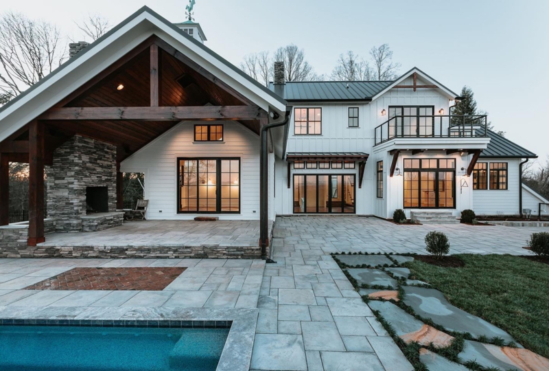 Backyard Patio Black Framed Windows with Outdoor Stone Fireplace Idea