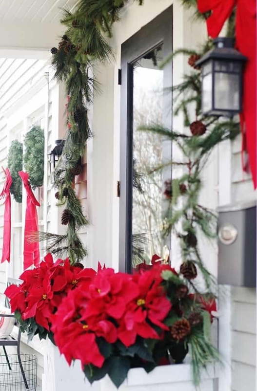 Black Double Doors with Symmetrical Holiday Wreaths and Lush Garland