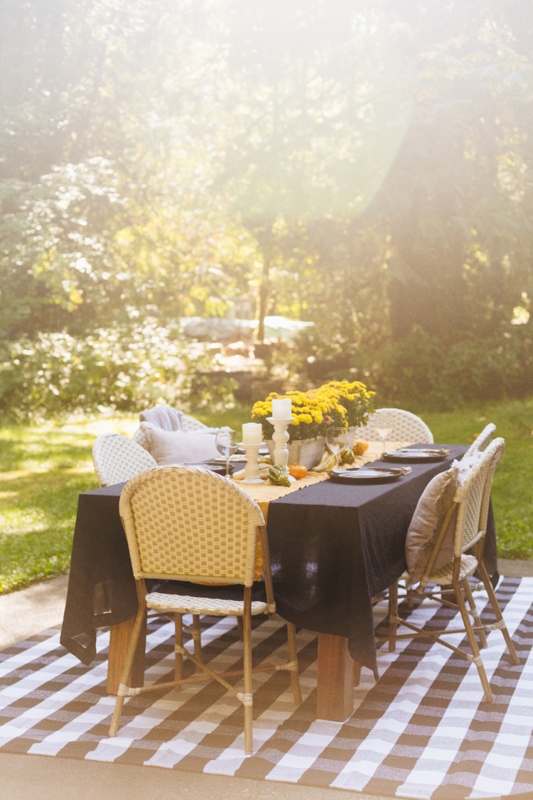 Black Wire Patio Chair with Seasonal Pumpkin Display