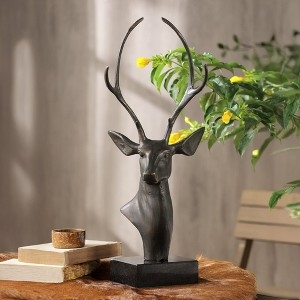 Bronze Finish Sculpture with deer head silhouette and tall antlers.