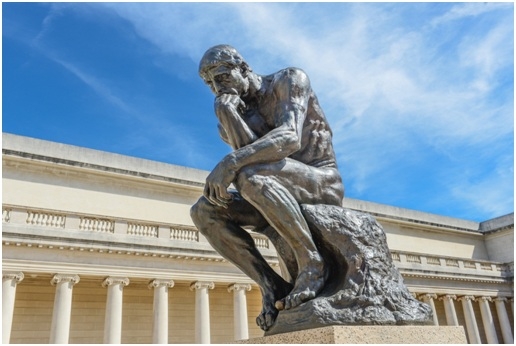 Classical Athlete Statue in Dynamic Pose with Aged Patina Finish