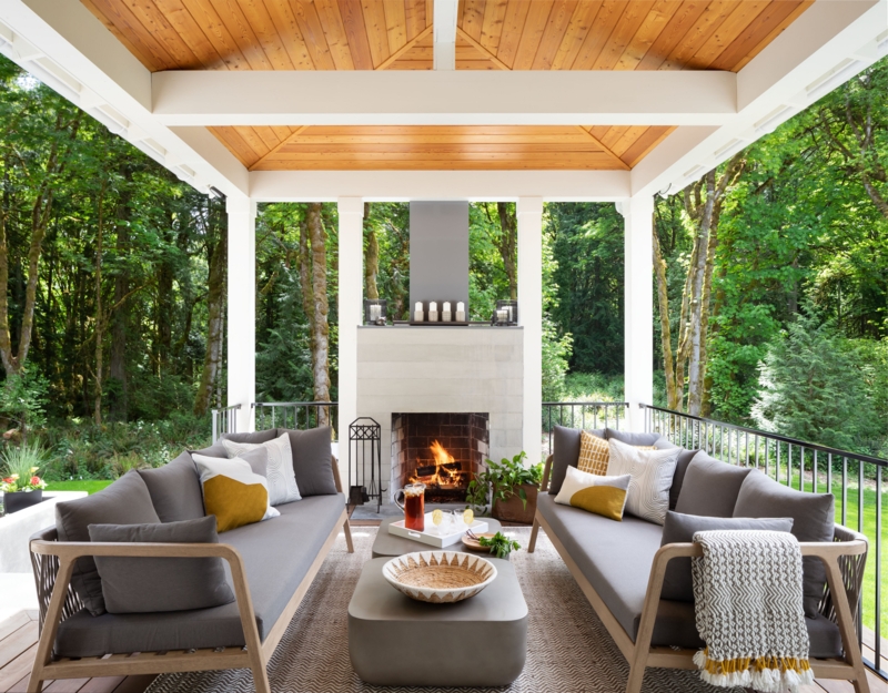Covered Patio Rustic Stone Fireplace With Exposed Beams Lounge Area